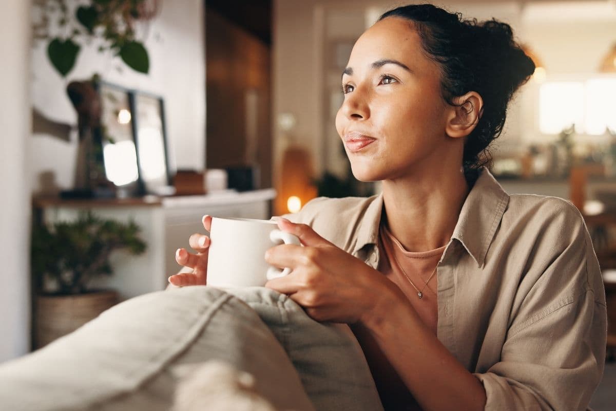 Woman relaxing pain free while drinking tea